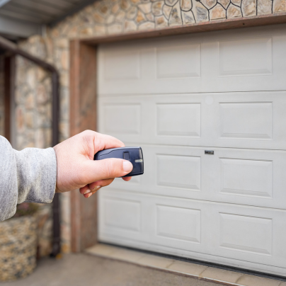 Fresno security key fob pointing to a garage door